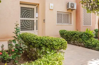 a front door of a house with bushes at A Thousand and One Night Dream in Marrakech in Marrakech