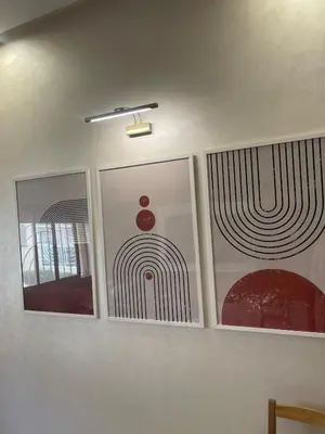 four paintings on a wall in a room at A Thousand and One Night Dream in Marrakech in Marrakech
