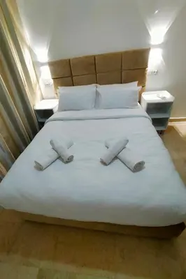 a bedroom with a bed with two towels on it at Cozy Apt in Heart of Marrakech, Walk Everywhere in Marrakech