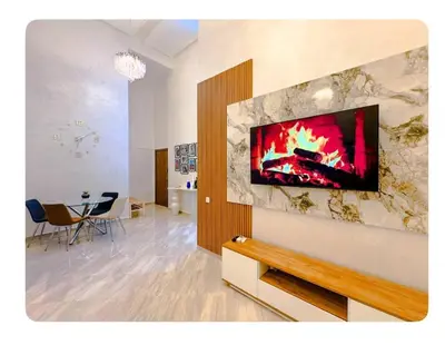 a living room with a fireplace in the wall at Cozy apartment with a pool2 in Marrakech