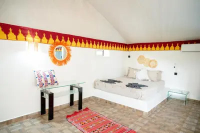 a room with a bed and a table in a room at Oléa villa & lodge in Marrakech