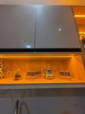 a shelf with several tea pots and cups on it at Housna B&B Marrakesh in Marrakech