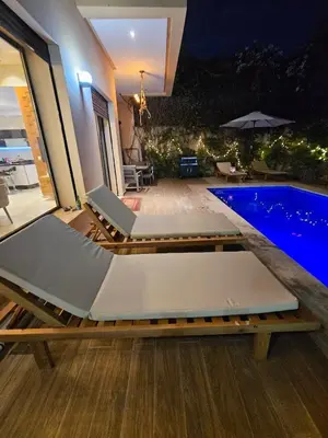 a villa with a swimming pool at night at Villa in Marrakech in Marrakech