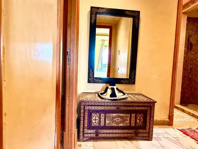 a mirror on top of a table in a room at la palmeraie village 3 in Marrakech