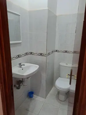 a bathroom with a sink and a toilet at Sweet home in Marrakech