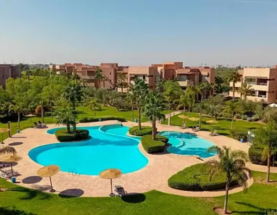 an overhead view of a swimming pool in a resort at Opulent 3BR apartment, pool view in Marrakech