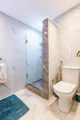 a bathroom with a shower and a toilet at Luxury CINÉMA-BEDROOM AK38 FullHD Guéliz-TopCenter in Marrakech