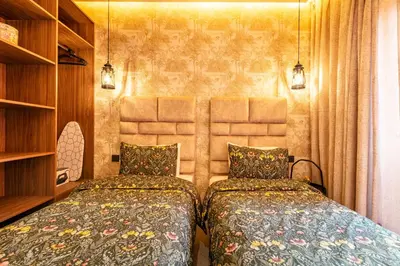 two beds sitting next to each other in a bedroom at HS14 Luxury 2Chambres Gueliz TopCenter in Marrakech