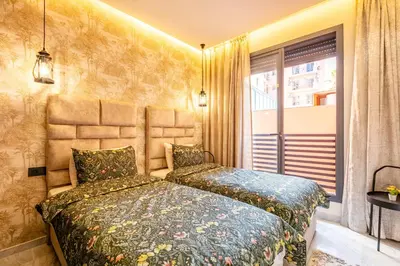 a bedroom with a bed and a window at HS14 Luxury 2Chambres Gueliz TopCenter in Marrakech