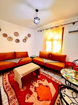 a living room with a couch and a table at Lalla Mama medina house in Marrakech