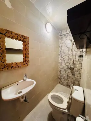 a bathroom with a sink and a toilet and a mirror at Lalla Mama medina house in Marrakech