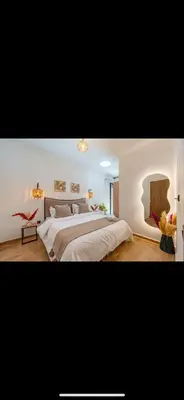 a large bedroom with a large bed in it at Évasion urbain de luxe climatisation fibre in Marrakech