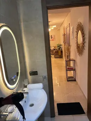 a bathroom with a sink and a mirror at Évasion urbain de luxe climatisation fibre in Marrakech