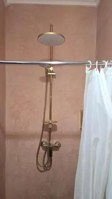 aendant light in a bathroom with a curtain at Authentic Riad & Jacuzzi in Marrakech