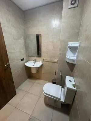a bathroom with a toilet and a sink at Studio au centre ville in Marrakech