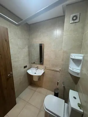 a bathroom with a toilet and a sink at Studio au centre ville in Marrakech