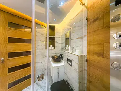 a bathroom with a shower with a toilet and a sink at Essalmi Luxury Apartment in Marrakech in Marrakech