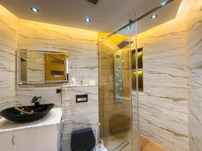 a bathroom with a sink and a glass shower at Essalmi Luxury Apartment in Marrakech in Marrakech