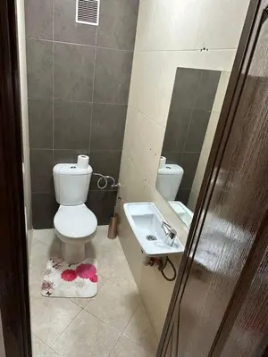 a bathroom with a toilet and a sink at Exceptionnel appartement a louer in Marrakech
