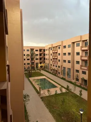 a view of an apartment complex with a swimming pool at Pool View Quiet et Comfort in Marrakech