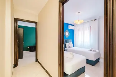 a mirror in a hotel room with two beds at Central Marrakech Apartment 2 Bedrooms Next to Majorelle Garden in Marrakech