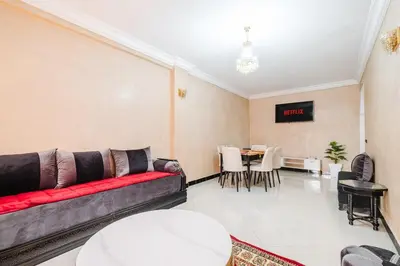 a living room with a couch and a table at Central Marrakech Apartment 2 Bedrooms Next to Majorelle Garden in Marrakech