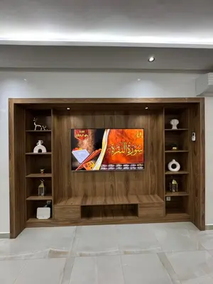 a living room with a flat screen tv on a wall at Duplex Menara Mall in Marrakech