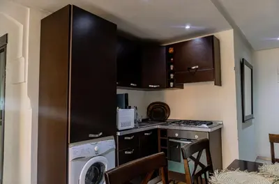 a kitchen with a washer and a dishwasher at Appartement 2 bedroom Babylone center in Marrakech