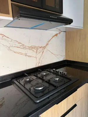 a stove top in a kitchen with a marble counter top at Marrakech charme urbain à l'hivernage in Marrakech
