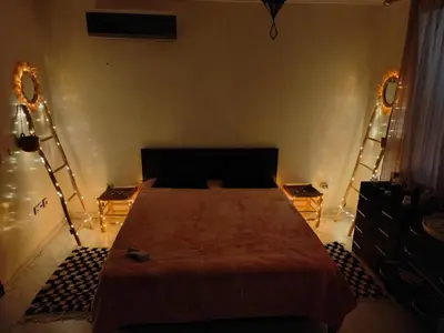 a bedroom with a large bed in a room at Happy House 2 in Marrakech