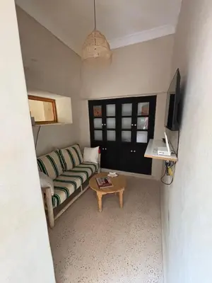 a living room with a couch and a coffee table at Dar Tiegezh in Marrakech