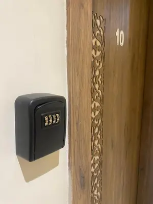 a black electrical box on the side of a door at Appartement magnifique in Marrakech