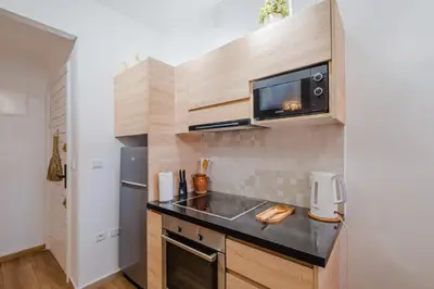 a kitchen with a sink and a microwave at Elegant and Confort Moderne au Coeur de la Ville in Marrakech