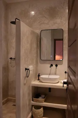 a bathroom with a sink and a mirror at Riad Dar Melia in Marrakech