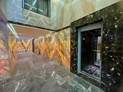 a lobby with a painting on the side of a building at Modern Oasis in Gueliz - Balcony & Comfort in Marrakech