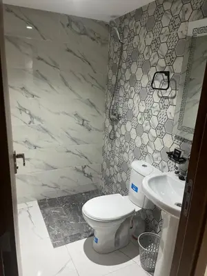 a bathroom with a toilet and a sink at Marrakech duplex apartment in Marrakech