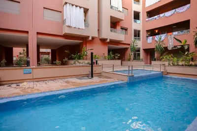 a swimming pool in front of a building at The Smooth Stay Marrakech Pool in Marrakech