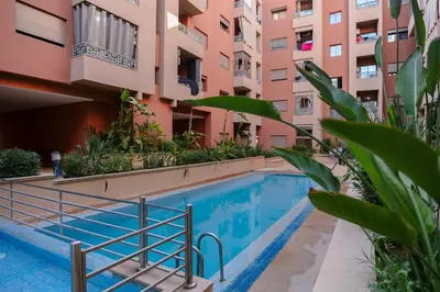 a swimming pool in front of a building at The Smooth Stay Marrakech Pool in Marrakech