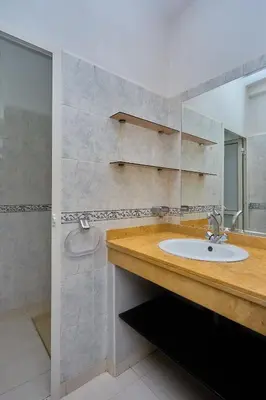 a bathroom with a sink and a mirror at appartement majorelle in Marrakech