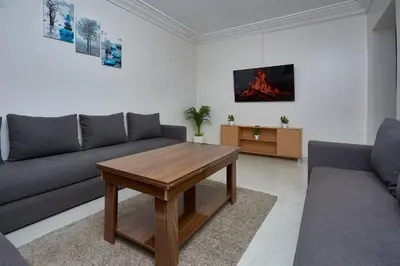 a living room with a couch and a table at appartement majorelle in Marrakech