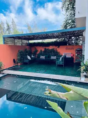 a swimming pool in the backyard of a house at Magnifique villa privée piscine 3ch, centre in Marrakech