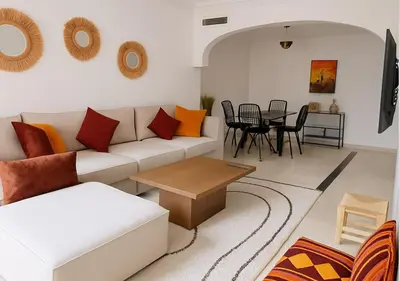 a living room with a couch and a table at Appart Majorelle in Marrakech