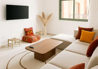 a living room with a couch and a table at Appart Majorelle in Marrakech