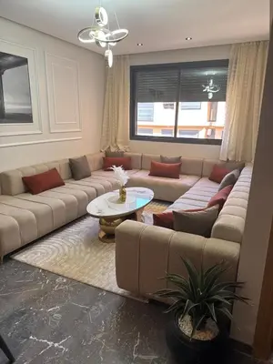 a living room with a couch and a table at Comfort & Elegance Marrakech in Marrakech