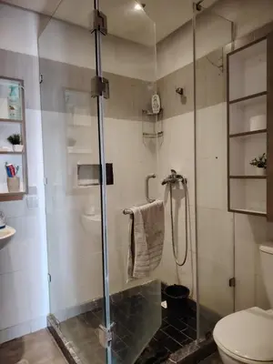 a bathroom with a glass shower with a toilet at Apartment heart of Marrakech in Marrakech
