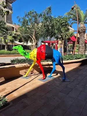 a colorful toy dog on display on a sidewalk at M Résidence Marrakech Luxury Serviced Apartments in Marrakech