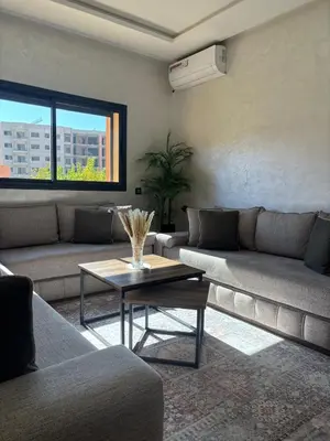 a living room with a couch and a coffee table at Cozy Family Apartment 2BR Pool Parking Gueliz Marrakesh in Marrakech