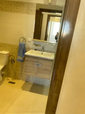 a bathroom with a sink and a mirror at pleasant stay in Marrakesh in Marrakech