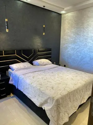 a bedroom with a large bed in a room at pleasant stay in Marrakesh in Marrakech