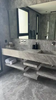 a bathroom with two sinks and a large mirror at Villa Talya in Marrakech